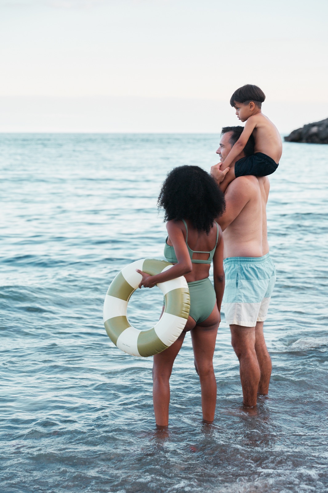 Family walking on the beach at Lakeview